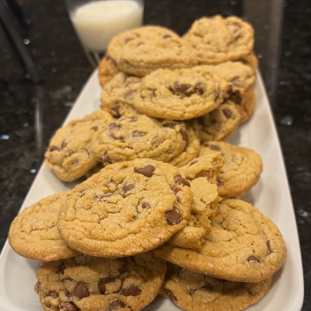 A platter piled with fresh chocolate chip cookies