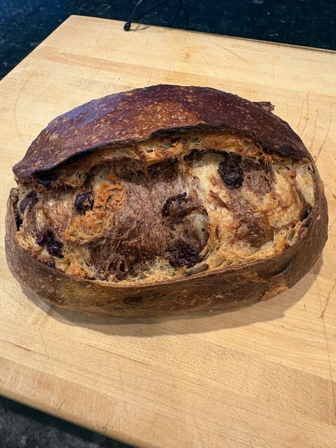 A lemon blueberry sourdough loaf studded with berries